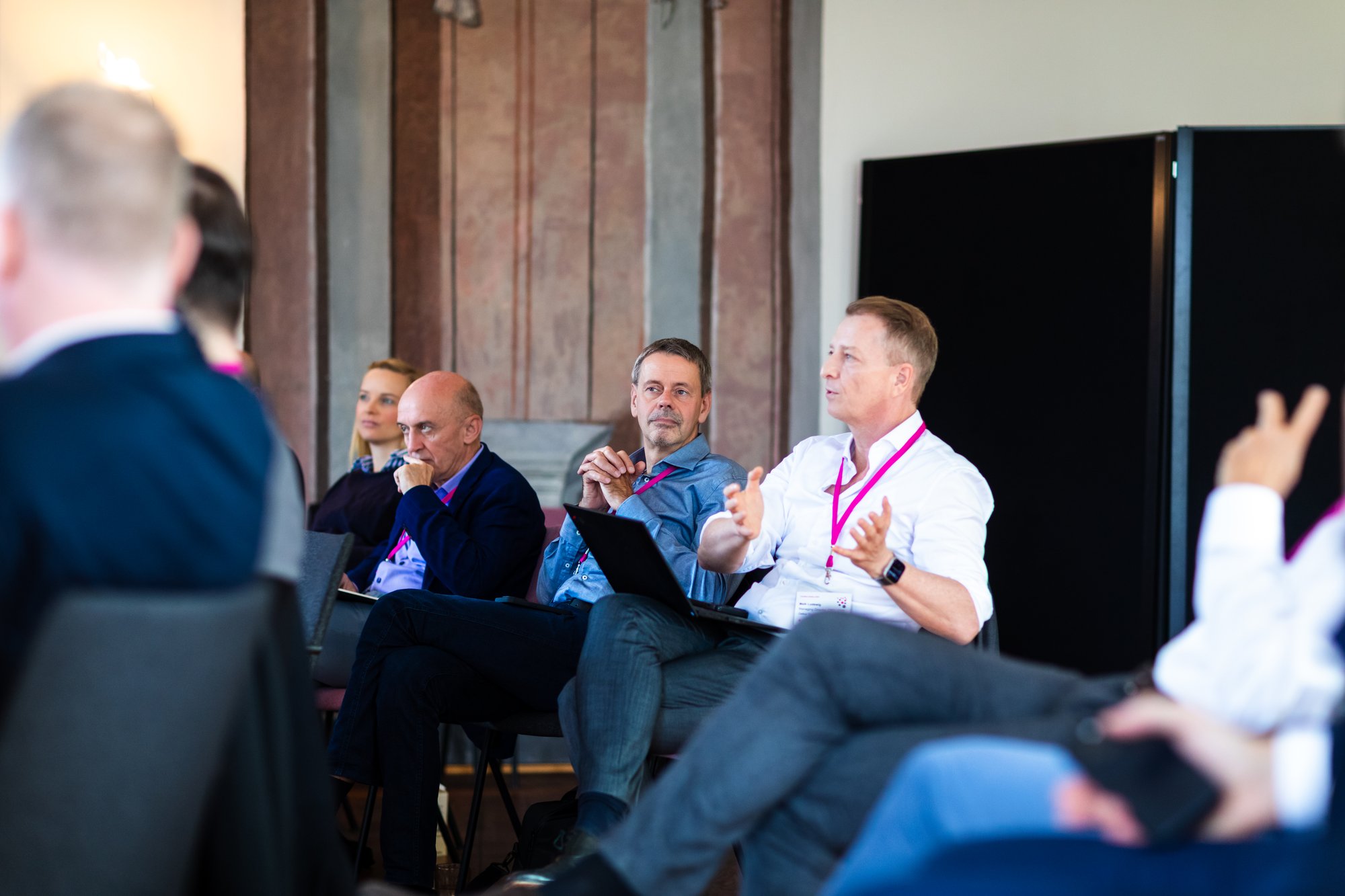 Maik Ludewig posing a question while Prof. Dr. Mirko Conrad sits next to him Maik Ludewig posing a question while Prof. Dr. Mirko Conrad sits next to him