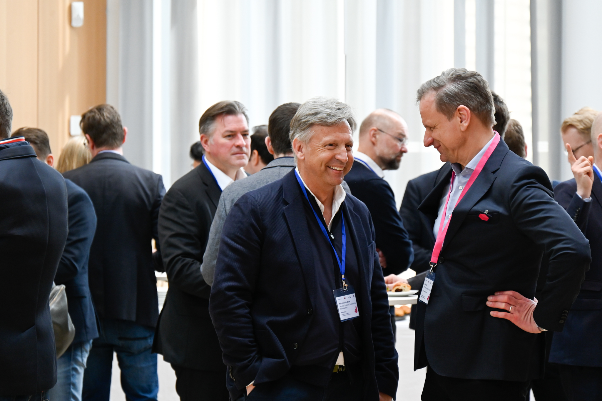 Oliver Viel and Nils-Joachim Bauer Exchanging Thoughts at the HPI with Oliver Laitenberger in the Background